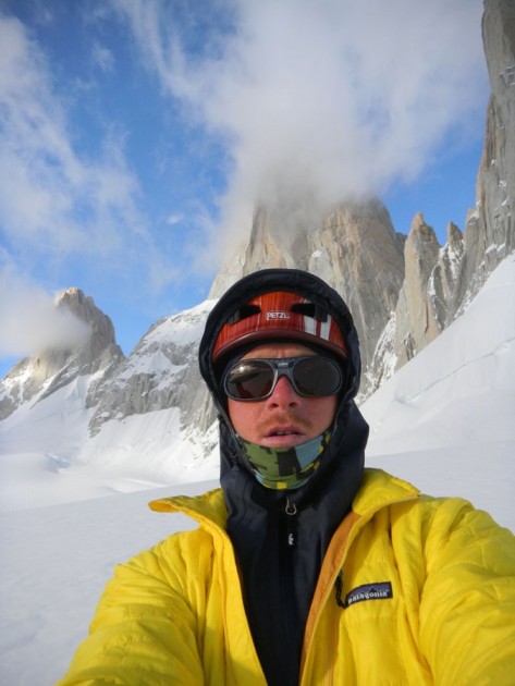 luke lydiard on a patagonian glacier with poincenot in the back. he...