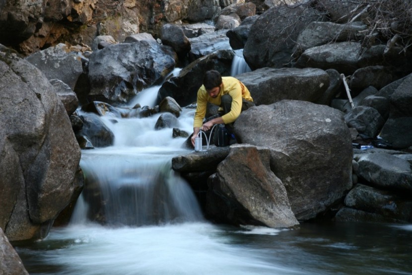 katadyn hiker pro - dan sandberg uses the  hiker pro to filter water from a running...