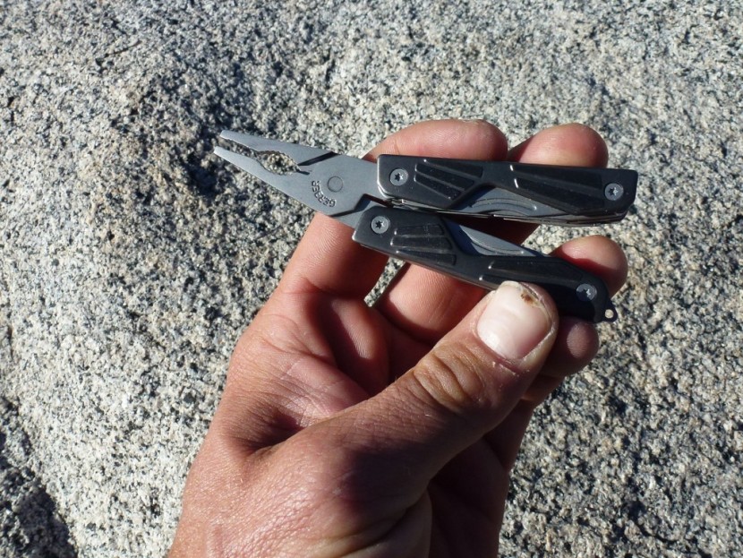 gerber bear grylls compact multi-tool - in this case, applying the pressure required to cut the hanger...