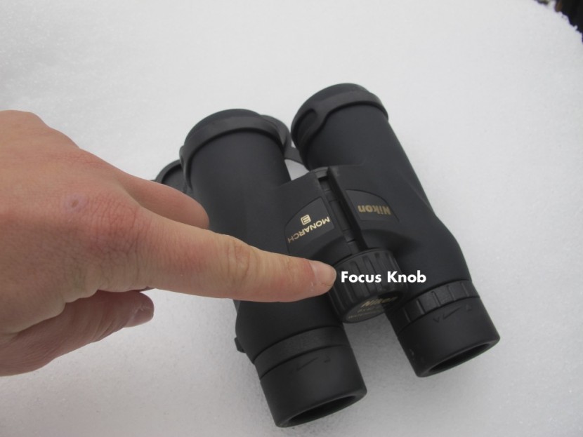 binoculars - the focus knob is located in between the barrels, and will assist in...