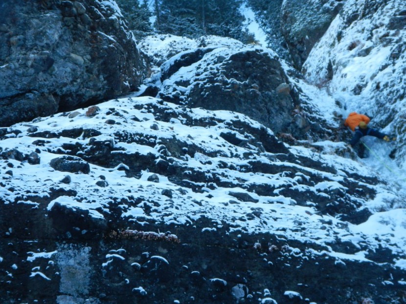 down jacket men - ice climbing in east fork hyalite canyon, montana.