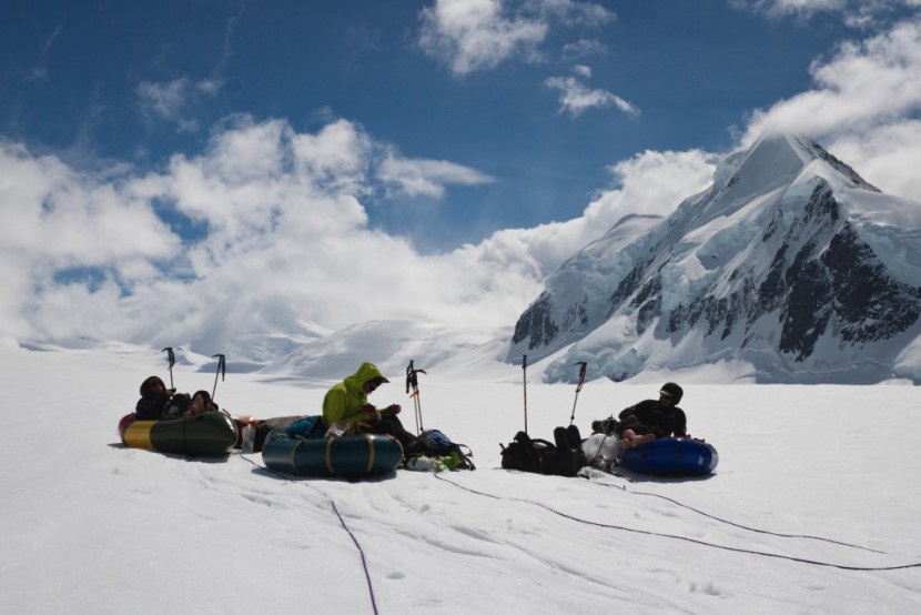 graham kraft, danny powers, and marcus waring rest their feet en...
