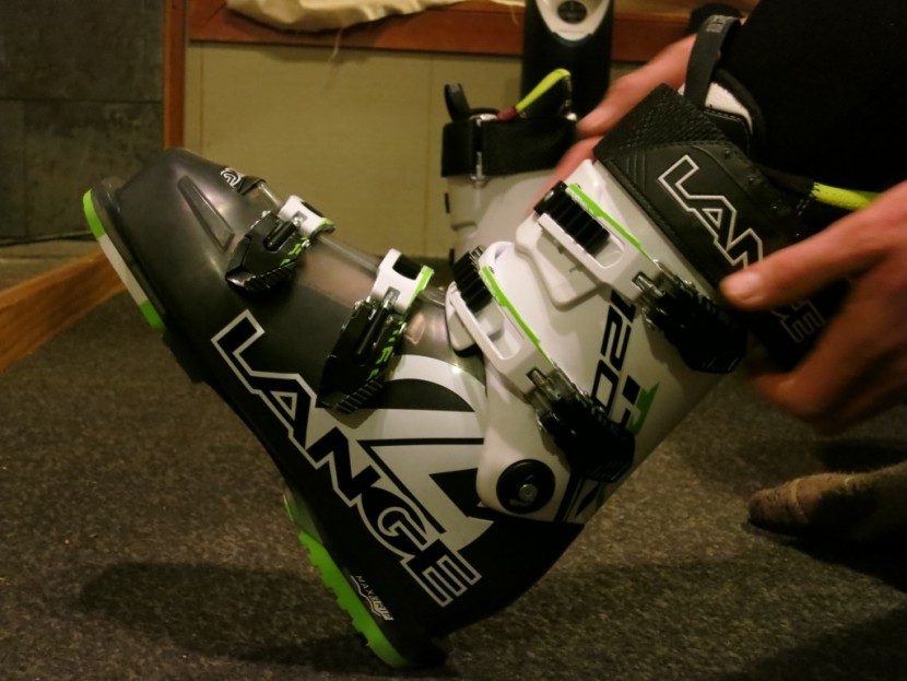 ski boots - when trying on boots with the liner, kick your heel into the ground...
