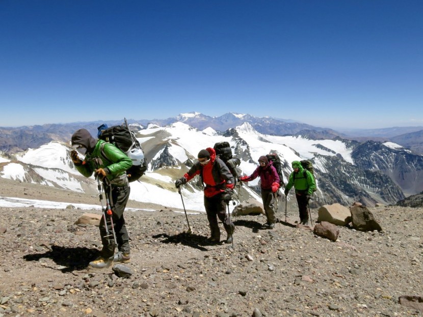 down jacket men - wearing lightweight down jackets to fend off the cold and wind on a...