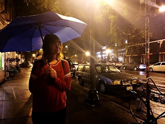 kolumbo travel umbrella - reviewer mandy toomey wards off an evening of rain on the streets of...
