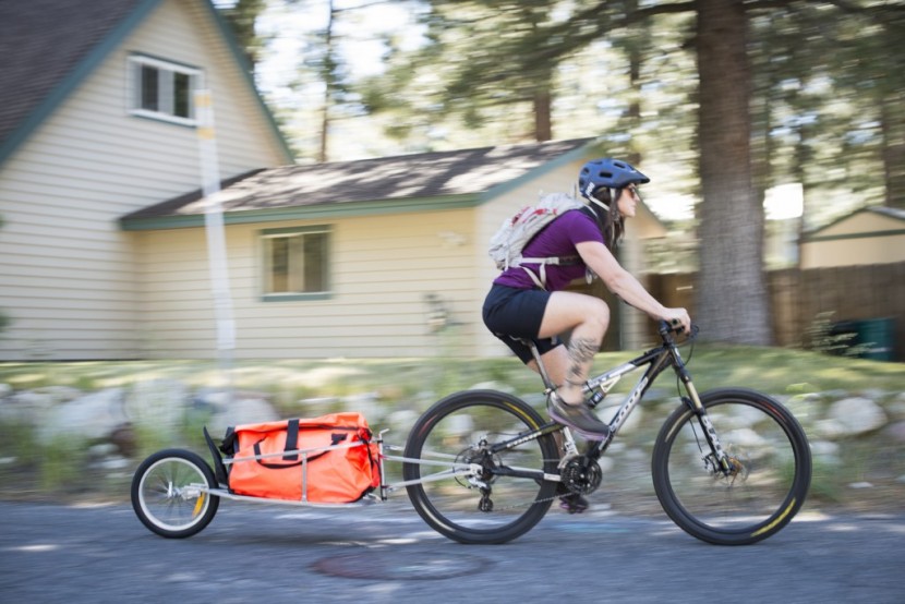 aosom solo - the aosom solo single wheel bike cargo trailer in action; the bright...