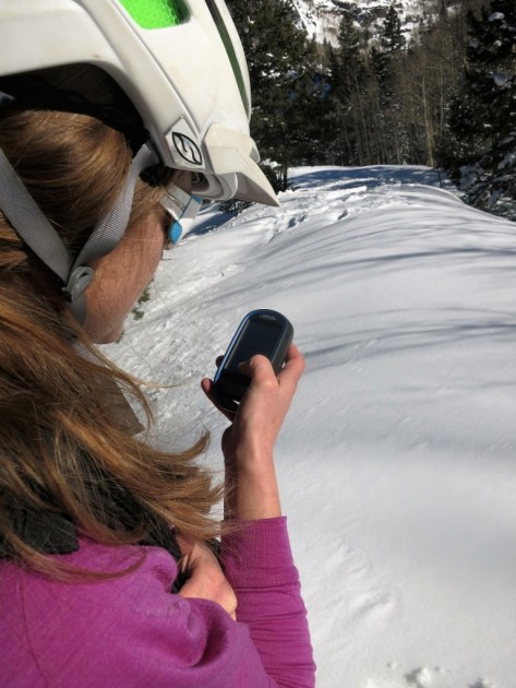 magellan explorist 510 - kelly checks her tracks while skiing in colorado.