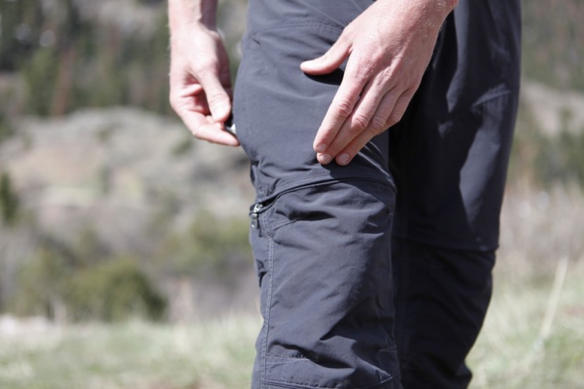 kuhl liberator convertible - inserting a cell phone into one of the dual zippered side pockets...
