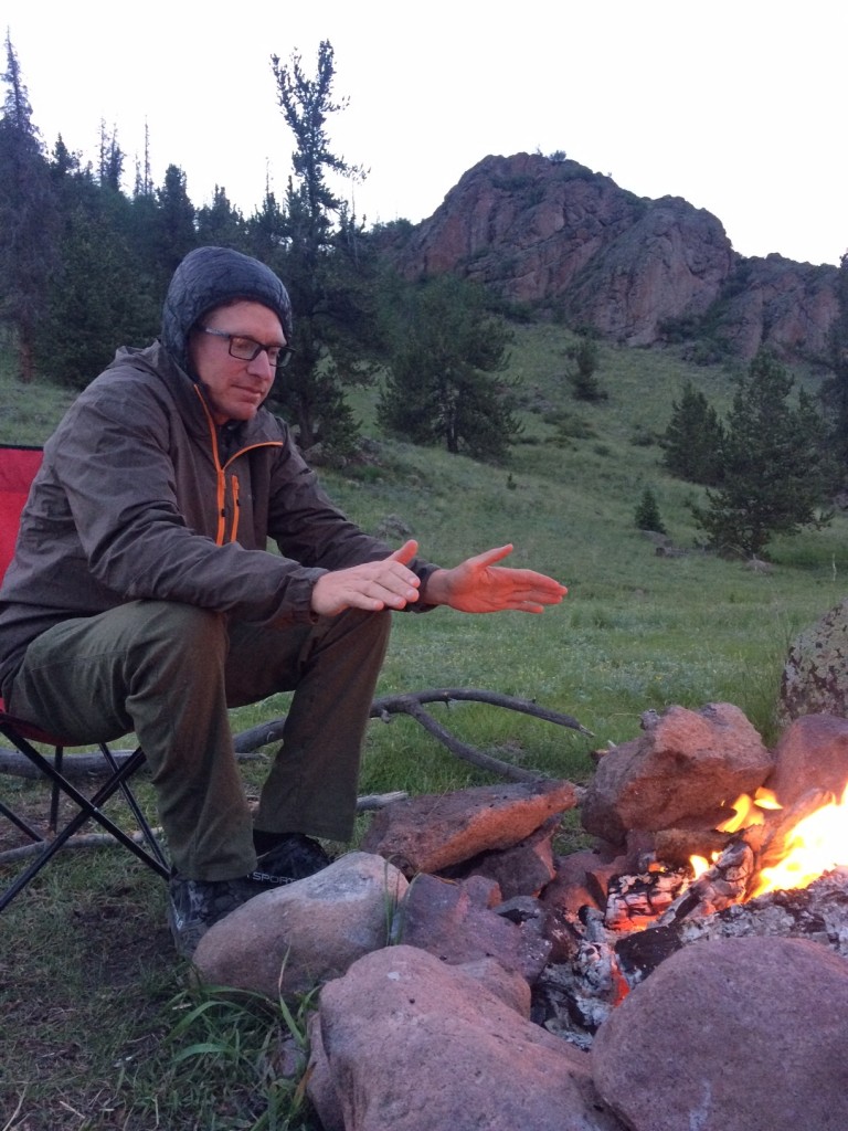 wind breaker jacket - layering up on a chilly night in the mountains around the fire. the...