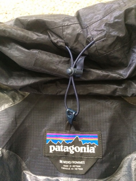 patagonia alpine houdini - the hood draw cord on the alpine houdini comes with a hook tab that...