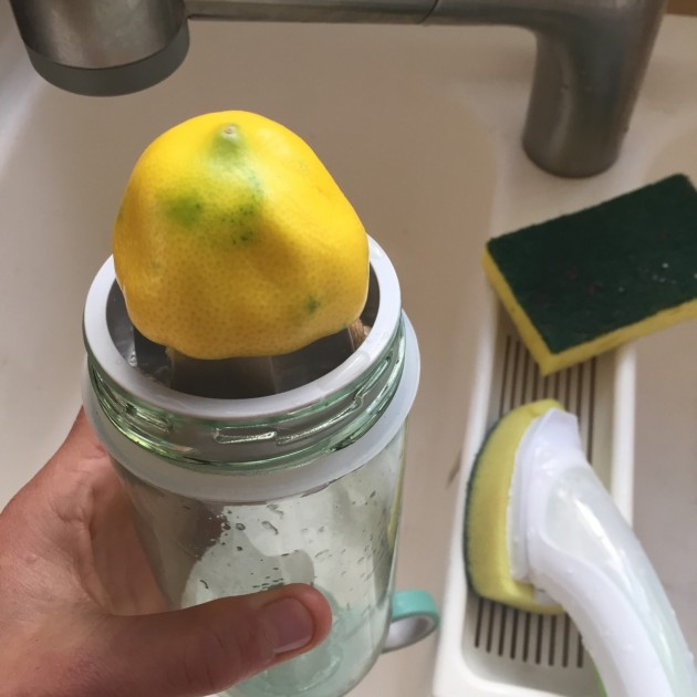 citrus zinger sport - a lemon sits on the juicer, the unique feature gives the citrus...