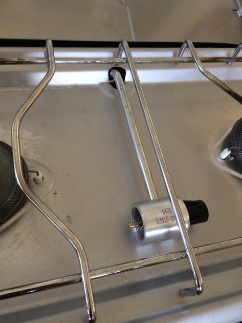 coleman triton plus - this stove has a small recess to nest the fuel attachment elbow and...