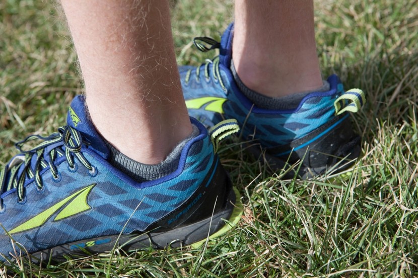 running socks - showing the no-show height of these socks, resting just below the...
