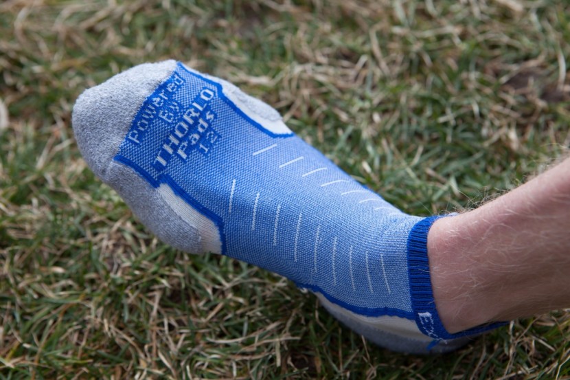 thorlos experia xccu - shown here is the grey padding that covers the sides of the feet and...