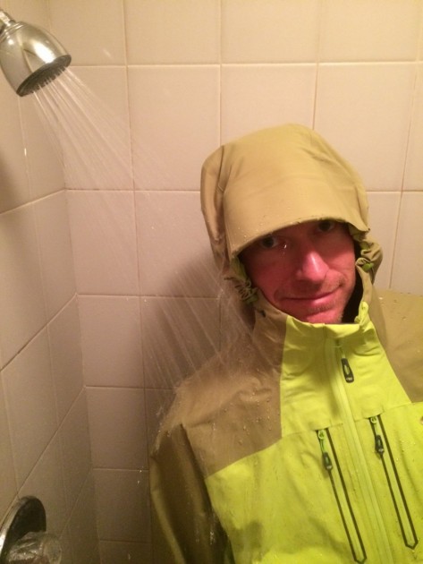 outdoor research furio jacket - testing this jacket in the shower, notice the very large arcing brim...