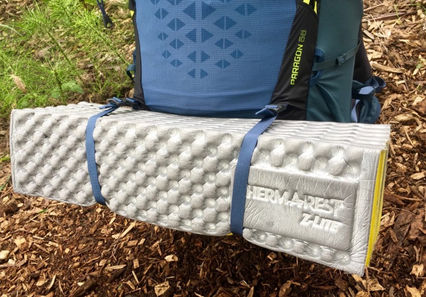 gregory paragon 68 - the paragon features two straps over the sleeping bag compartment...