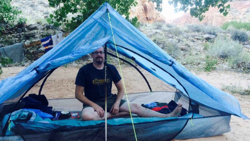 zpacks duplex classic - tom (5&#039;11&quot;) is shown sitting up in the center of the tent. the...