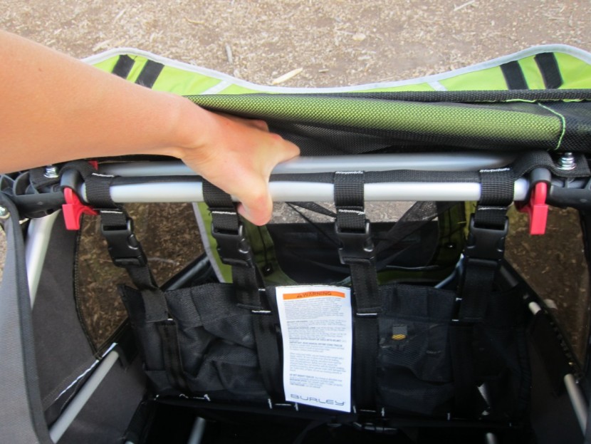 bike trailer - assembling and setting up the burley d&#039;lite requires squeezing the...