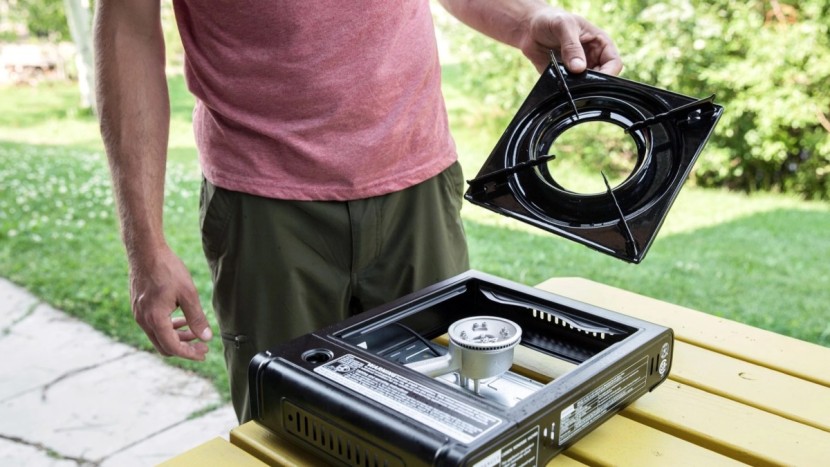 camping stove - a removable drip pan makes it easier to clean the surface and...