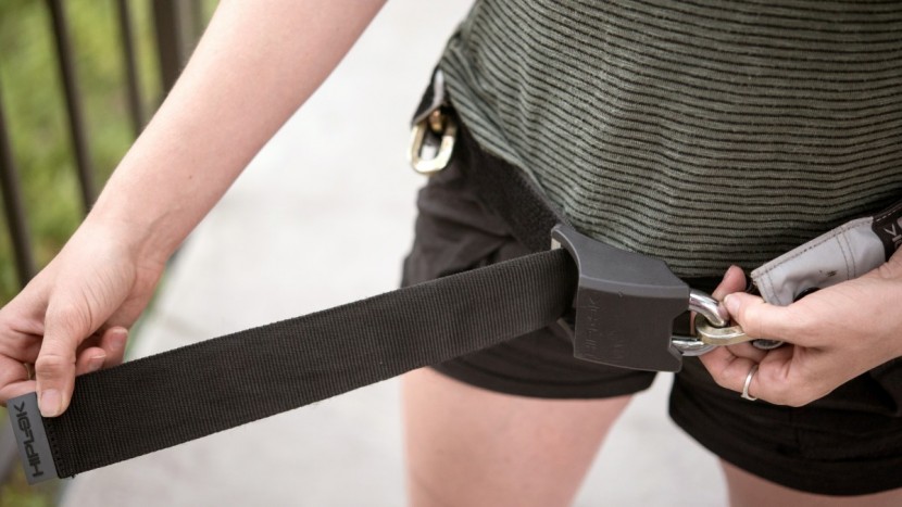 with the shackle locked to a chain link on one end, the strip of...