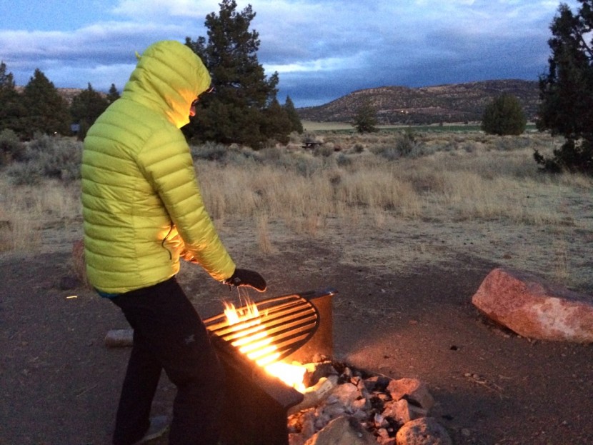 arc&#039;teryx perimeter - trying to warm up by the fire on a chilly and windy night camping...
