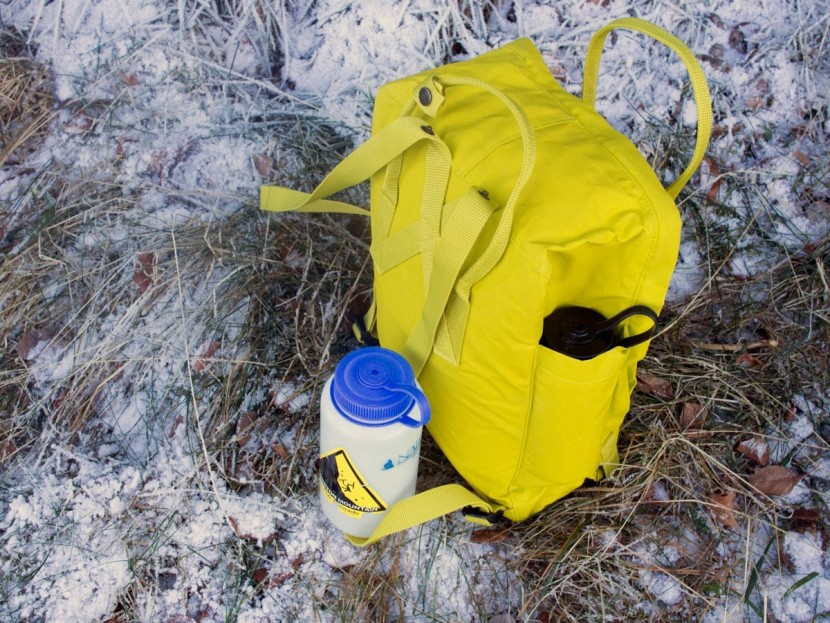 fjallraven kanken classic 16l - the small side pockets are just big enough to fit a half liter...