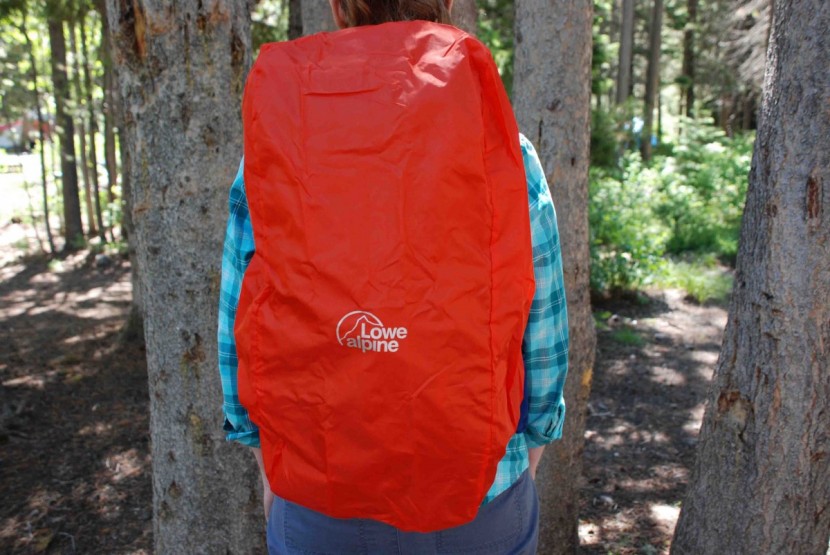 this rain cover stows in its own pouch in the bottom of the bag. it...