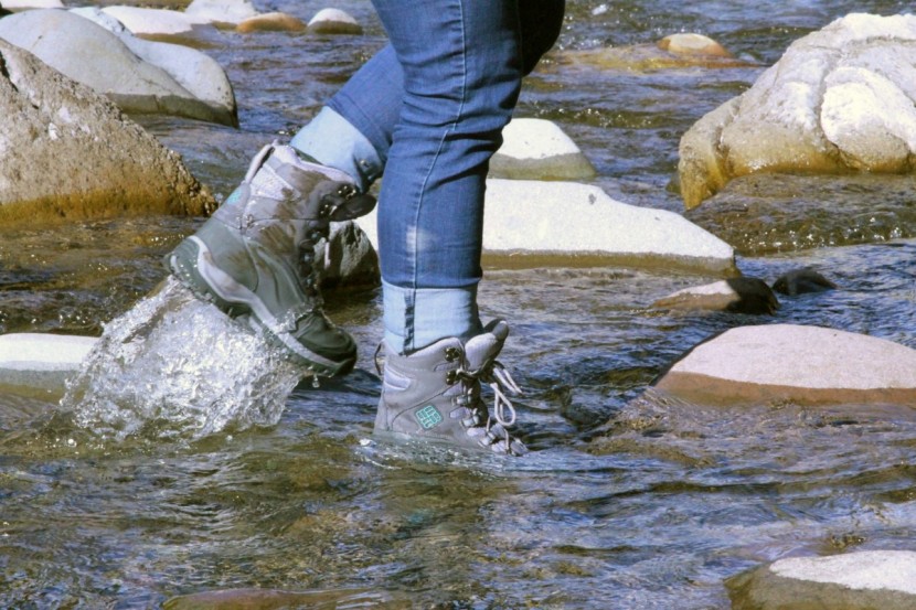 columbia bugaboot plus iii omni-heat for women - testing water resistance while hiking through a river in fall with...