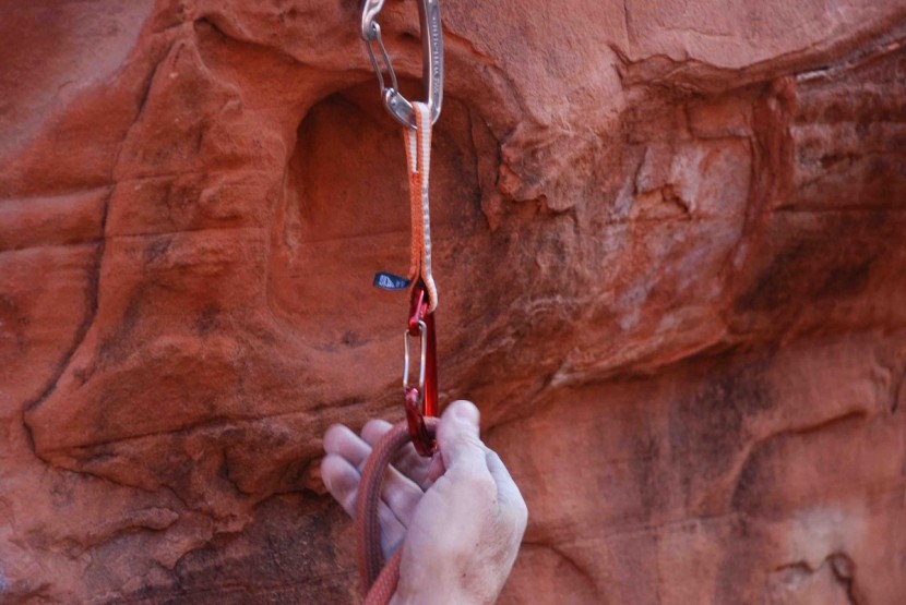 quickdraw - the positioner keeps the bottom carabiner in the proper orientation...