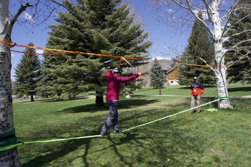 slackline - the overhead hand line helps the novice walk with confidence and the...