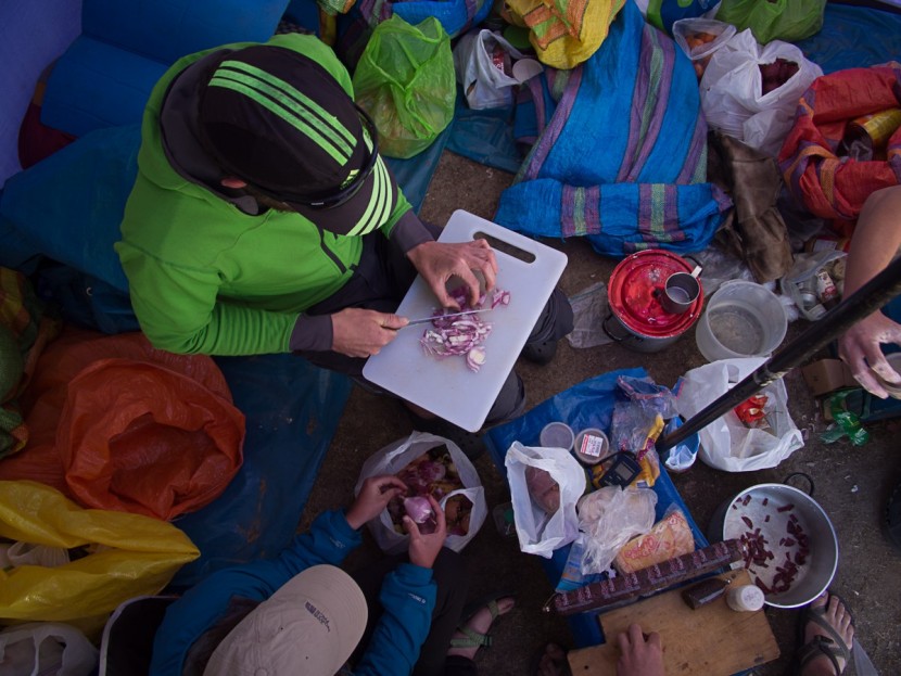 camping cookware - a cluttered camp kitchen for a large group. in this context, the sea...