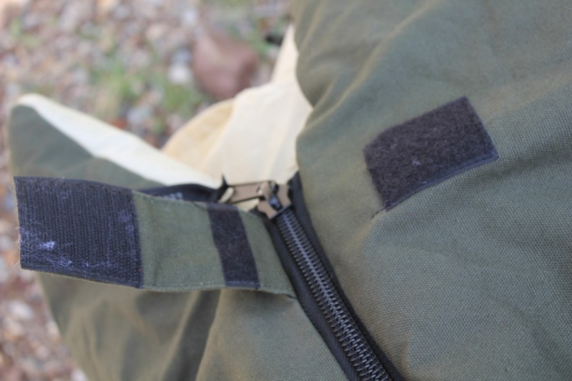 camping sleeping bag - a velcro strip helps keep your zipper closed.