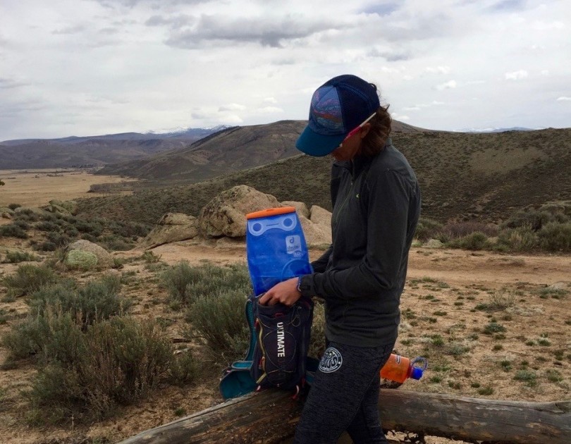 hydration bladder - alison fits the 3l deuter streamer into her small running pack. even...