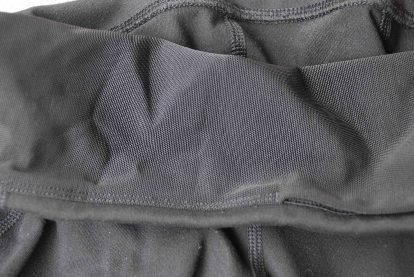 the north face perfect core high-rise - a close-up view of the mesh compression panel. this non-stretchy...