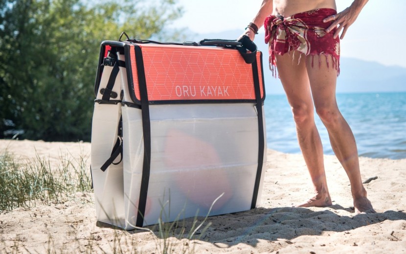 oru beach lt - the oru folds down to what resembles a large, messenger-style...
