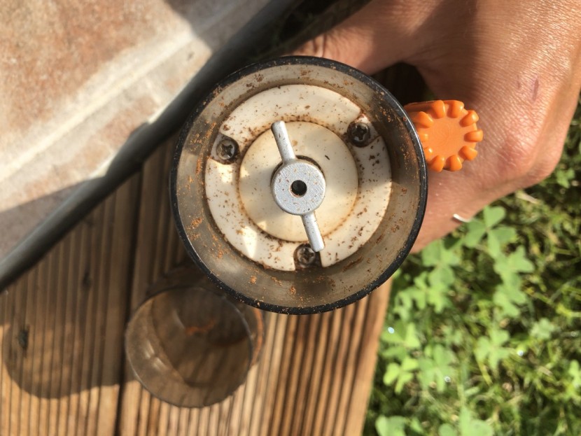 camping coffee - next to the burrs on the base of the grinder is a small dial for...
