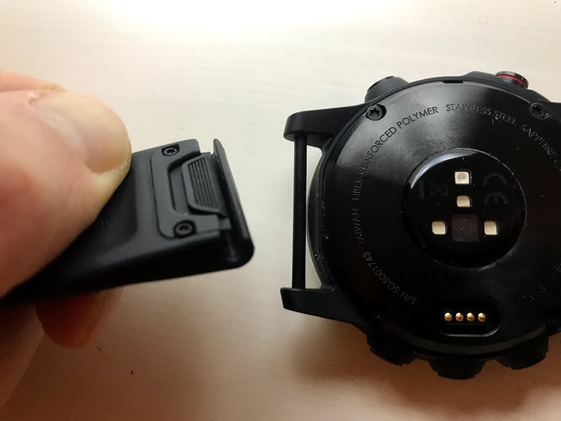 garmin fenix 5x plus sapphire - the slide tab on the wristband makes it easy to remove (and swap out).