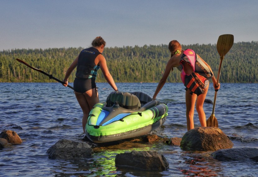 inflatable kayak - high schoolers challenge the durability of these kayaks by dragging...