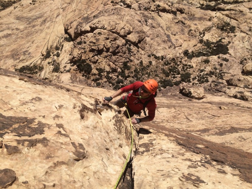 climbing slings - with a large selection of runners thrown over his shoulder, stefan...