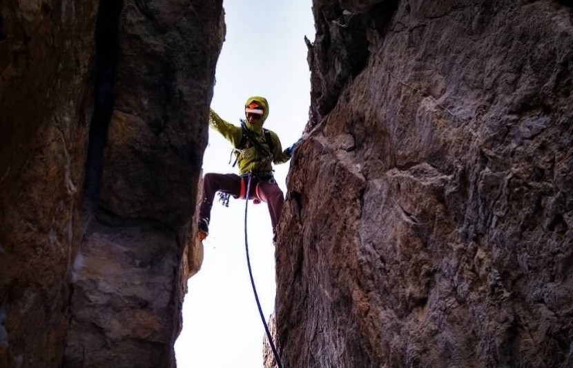 mountaineering boot - our lead tester making it happen on weird rock. this boot climbed...
