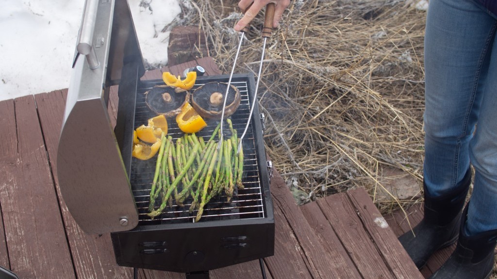 portable grill - the camp chef portable bbq grill in action.