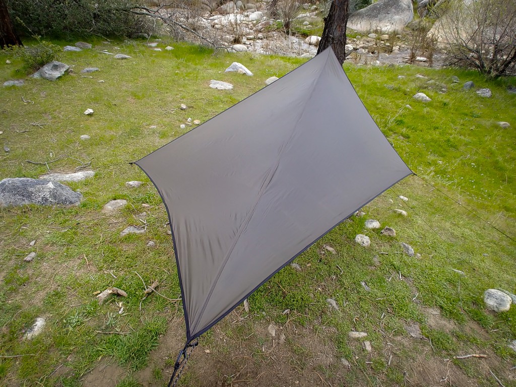 hammock - this diamond shaped tarp shaves weight but sacrifices some rain and...
