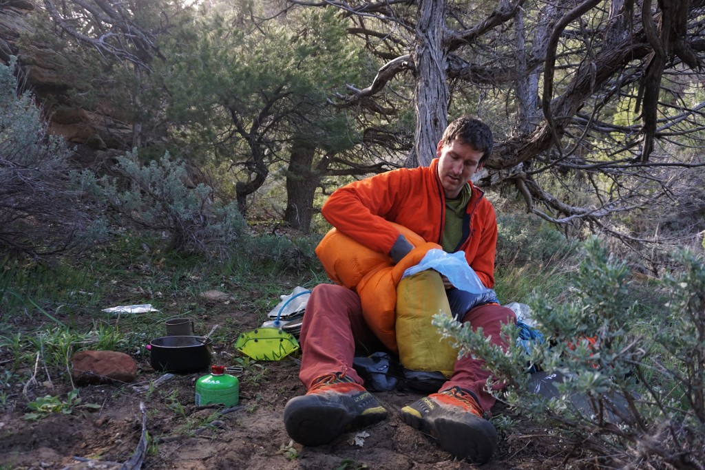 backpacking sleeping bag - down provides almost zero insulation if it gets soaked. avoid this...