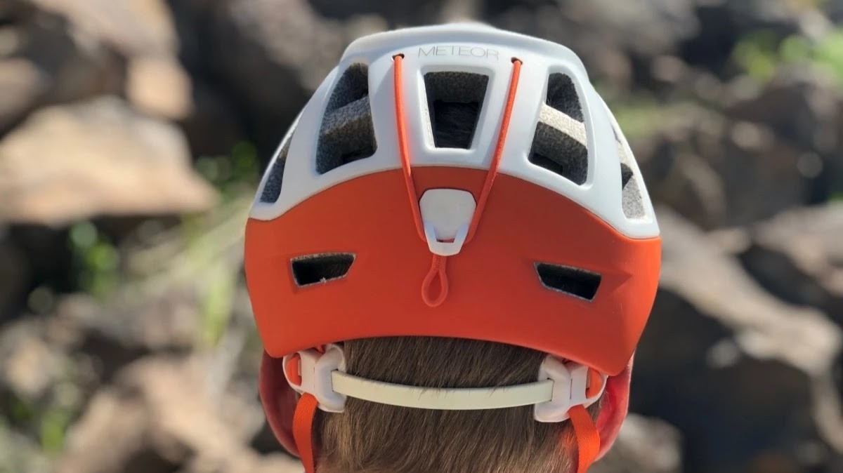 Petzl Meteor Review (Showing the back of the Meteor. You can see the white adjustment band that tightens up by pushing the two white...)