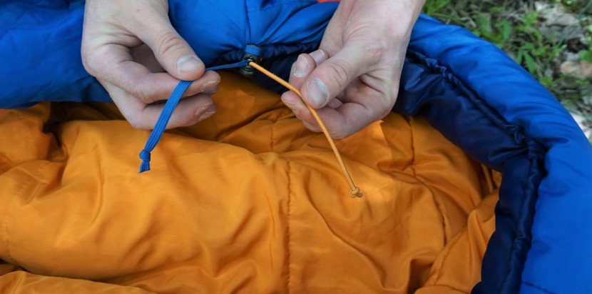 rei co-op trail pod 30 - the orange elastic cord and blue string operate the forehead and...