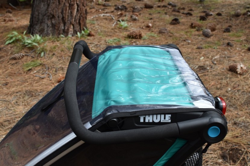 thule chariot lite 2 - this trailer, shown here with the rain shield covering the top and...