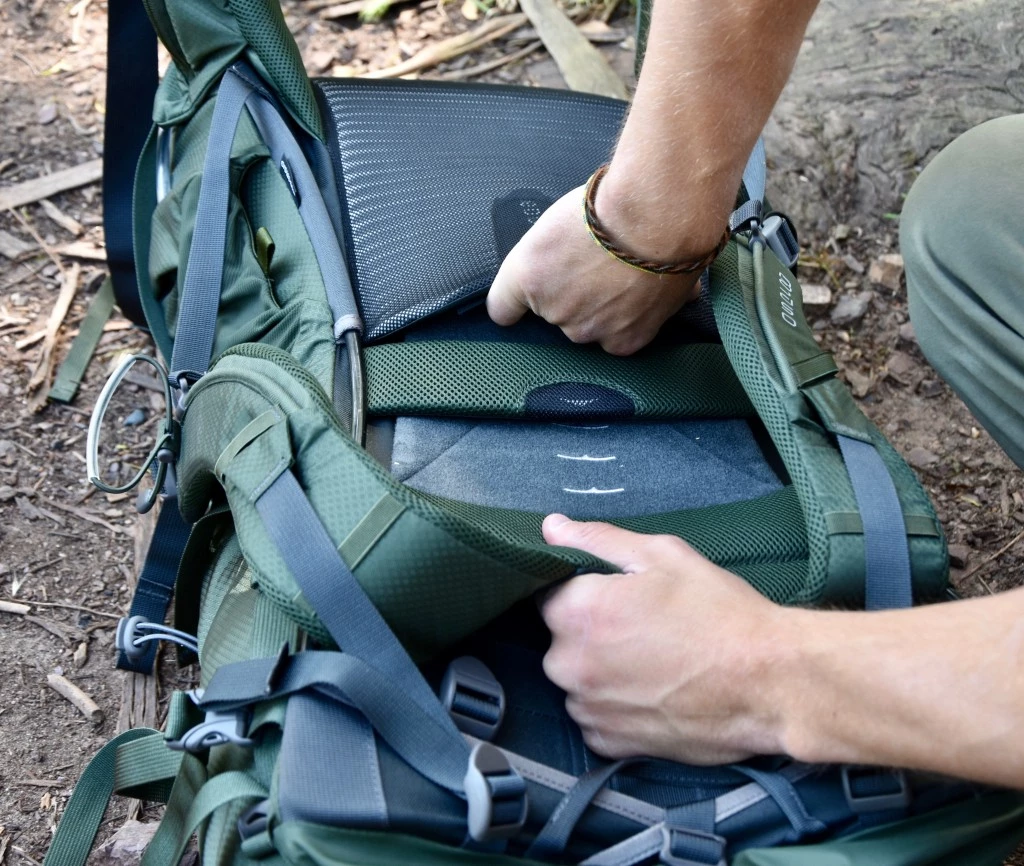 budget backpacking pack - many of the packs have a velcro adjustment system. simply pry open...
