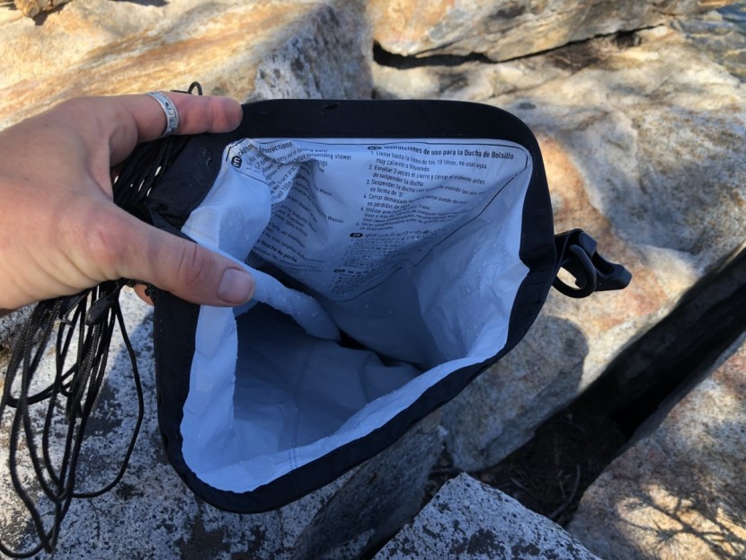 sea to summit pocket shower - a thin, dry bag-style option with directions helpfully printed inside.