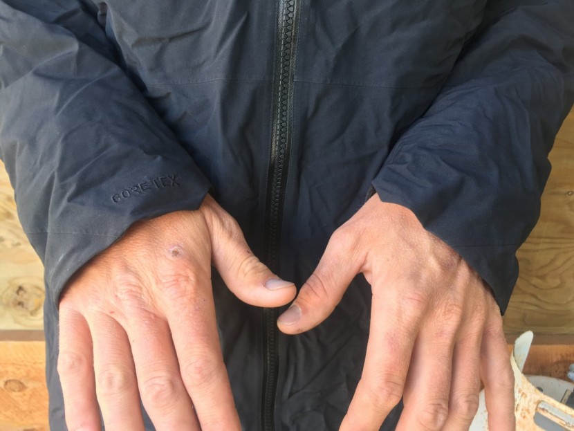 the outer shell cuffs are cut long on the outside of the hand for...