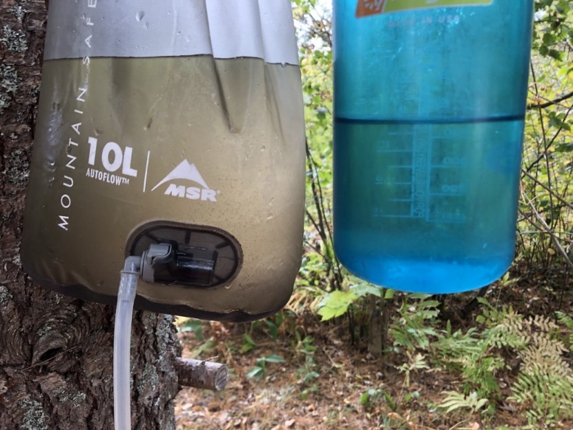backpacking water filter - water filtered from dirty to clean. while the autoflow removes...